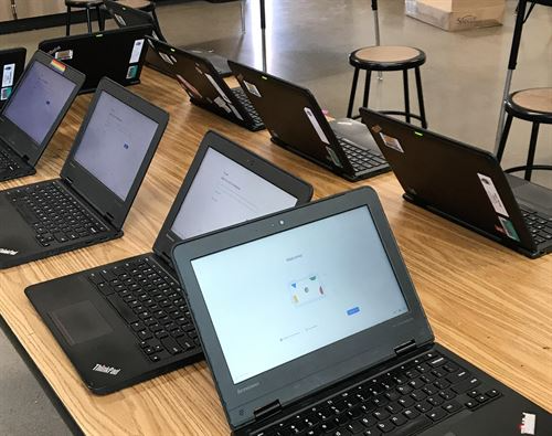Chromebooks on desktops in classroom