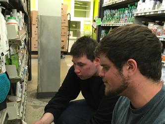 2 students looking intently at something